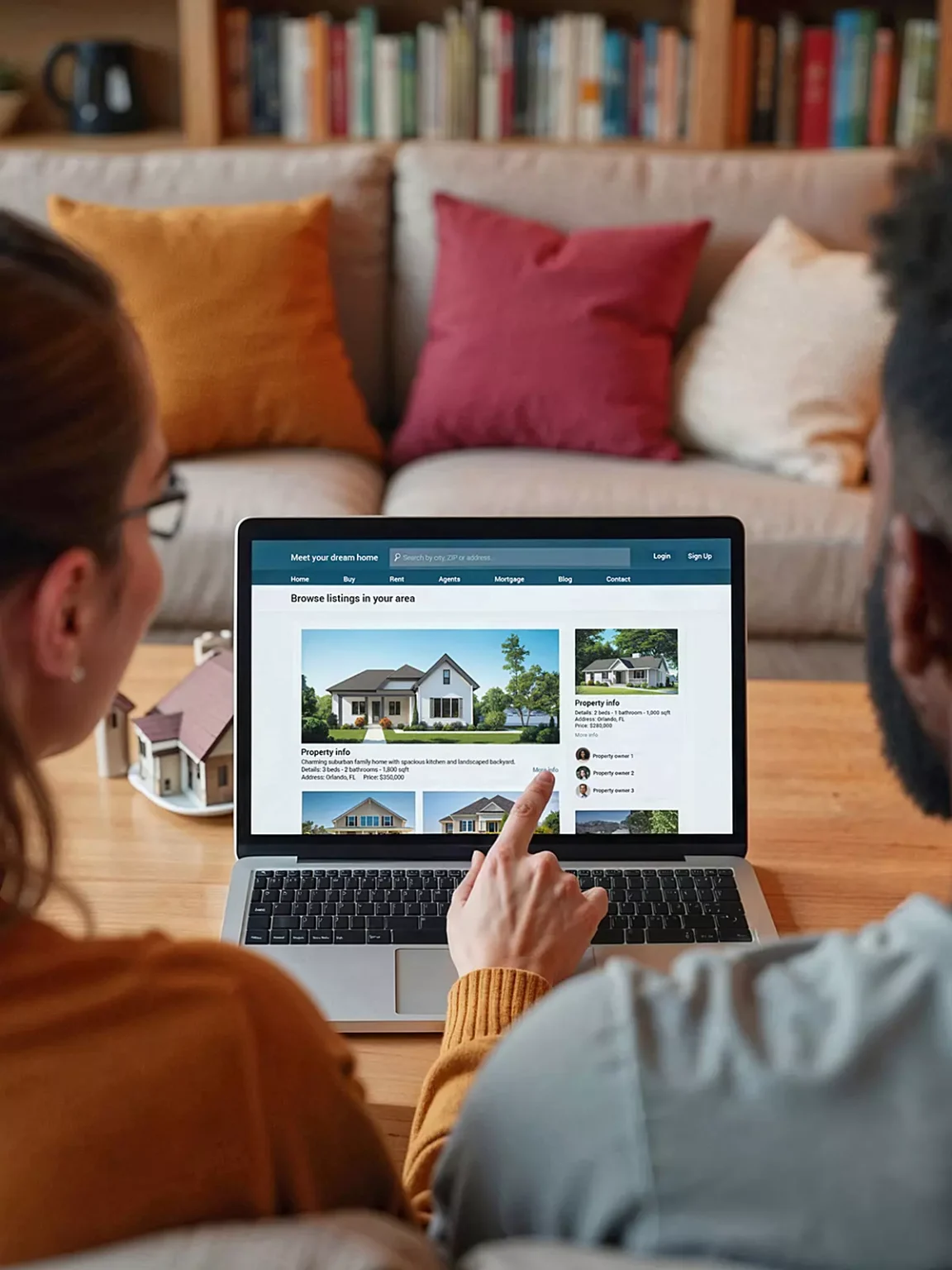 Couple viewing a real estate website on a desktop