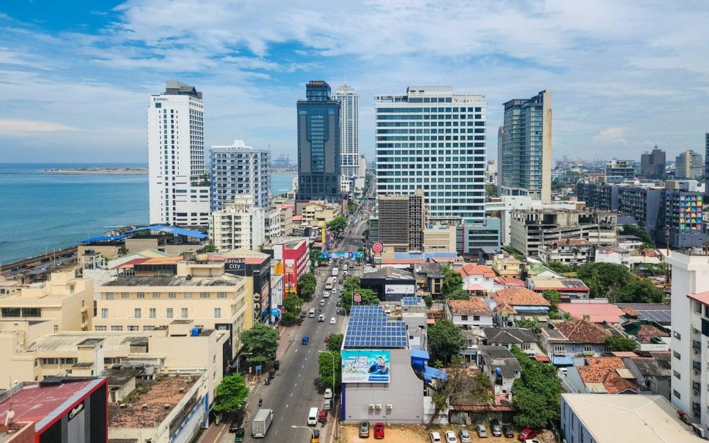 how to attract foreign real estate buyers A view of a city with tall buildings and the ocean in the background